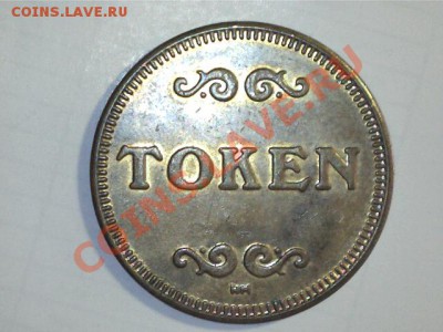 Жетона из металла желтого цвета с надписью TOKEN - 1204131342593281481