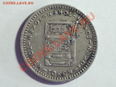 Жетон из металла белого цвета с игровым автоматом - image201205270002