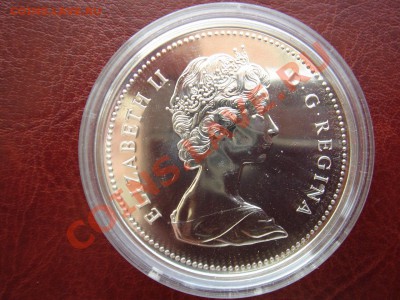 Канада: Ag-500 1$ 1976 UNC Библиотека в капсуле до 22.04 22 - Канада доллар 1976 библеотека-2.JPG