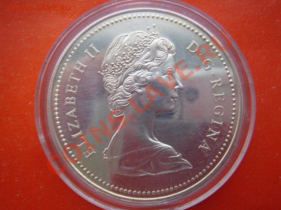 Канада: Ag-500 1$ Кон. полиция 1977 в кап. до 28.11.13 22-0 - Канада доллар 1973-2.JPG
