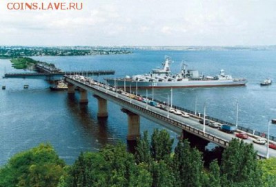 Для монеты скорее всего взяли данную фотографию.   На ней изображен ракетный крейсер 