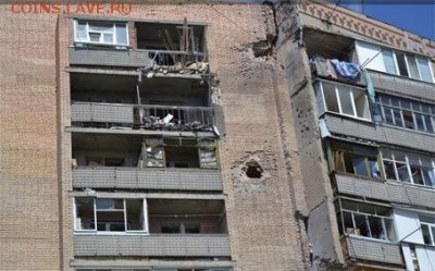 ... уверены, что так и должно быть... после попаданий стольких снарядов?!? - луганск 29_06_14 погила женщина