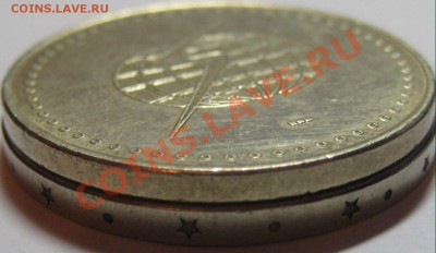 Иностранный жетон (земной шар и "молния") - 2010 новые 008
