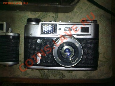 оценить 4 фотоаппарата - 26032011044