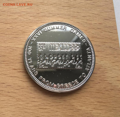 Крона Шайба Уганда 1000 шиллингов 1996 100 лет Олимпийским - krona_shajba_uganda_1000_shillingov_1996_100_let_olimpijskim_igram_mekhiko_1968_olimpiada_sport_marka